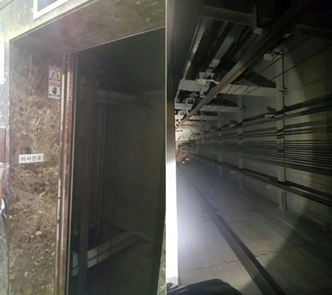 왼쪽에는 문이 열린 이사전용 엘리베이터 입구가 있고, 오른쪽에는 내부에 엘리베이터가 없는 텅 빈 승강로의 모습이 보인다.